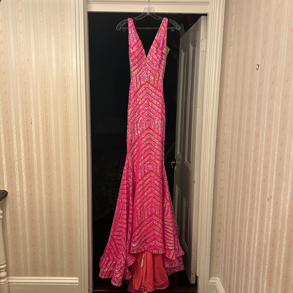 Hot Pink prom gown by Jovani.  Sequins from top to bottom. Worn one time.